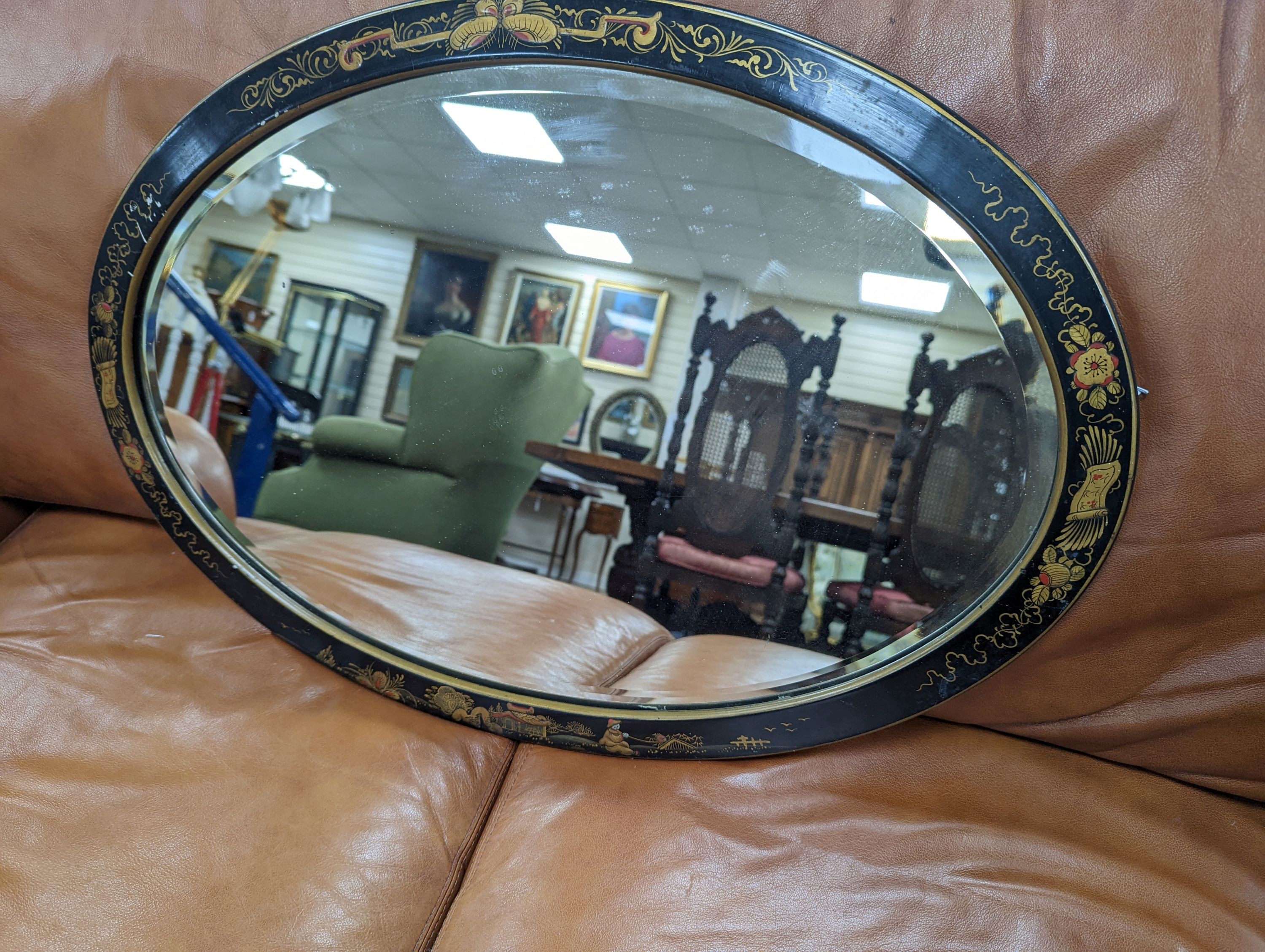 A 1920's oval chinoiserie lacquer wall mirror, width 67cm, height 46cm - To be sold on behalf of The Ukraine Appeal